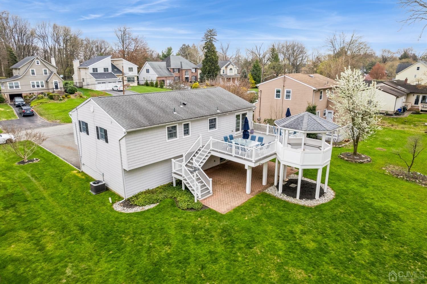 33 King Street Edison, NJ 08820 - Photo 4 of 44 a aerial view of a house with a big yard and large trees