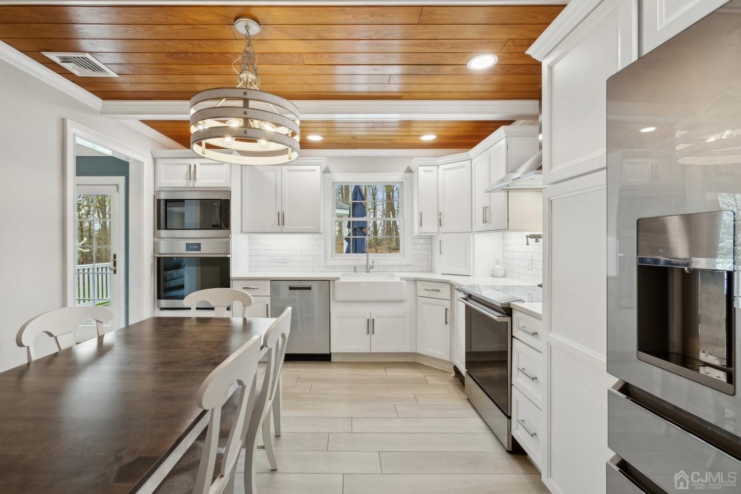 33 King Street Edison, NJ 08820 - Photo 6 of 44 a kitchen with cabinets and wooden floor