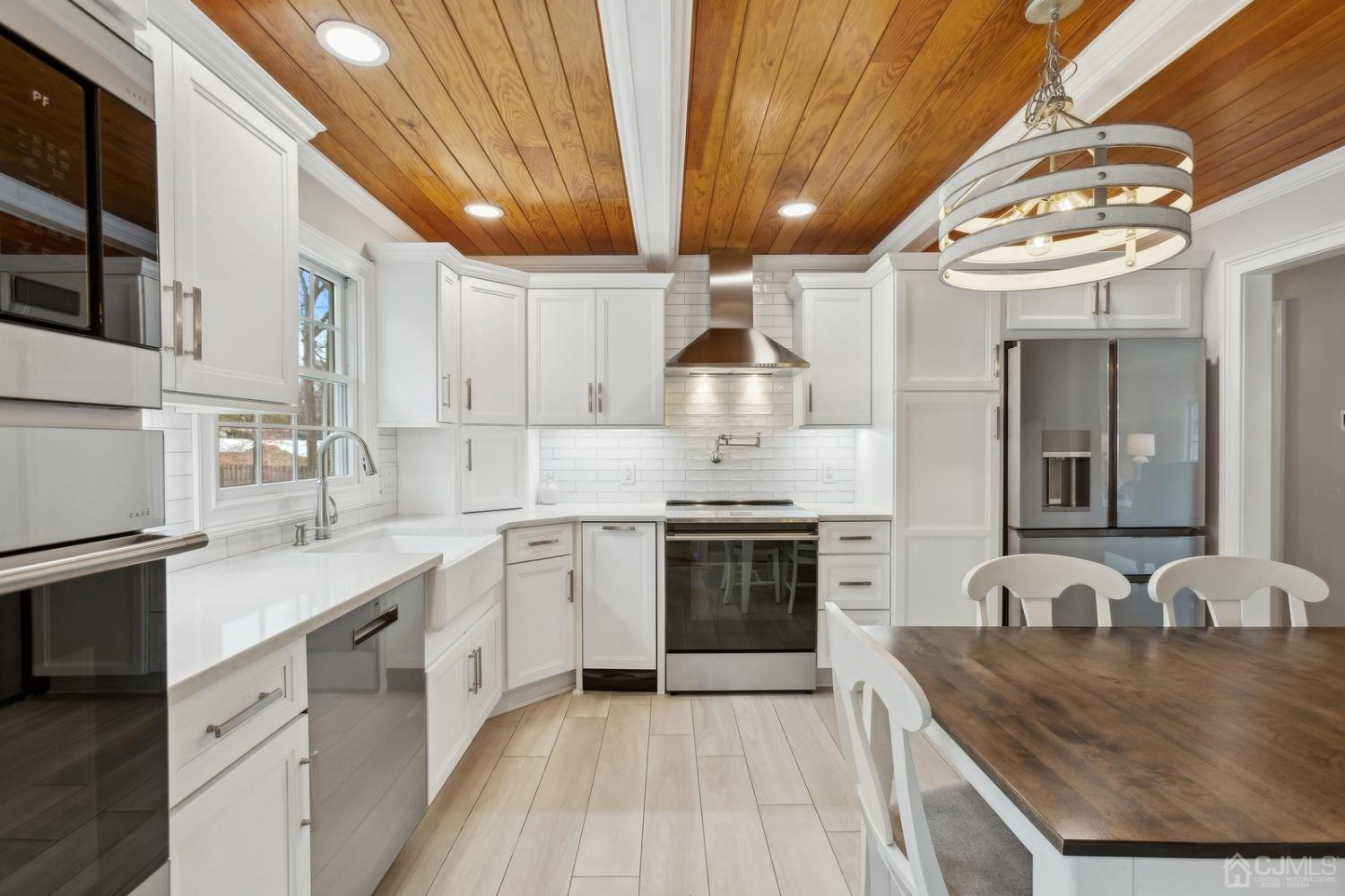 33 King Street Edison, NJ 08820 - Photo 7 of 44 a kitchen with stainless steel appliances granite countertop a sink stove and cabinets