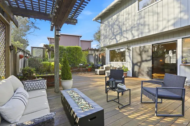 a outdoor living space with furniture and a potted plant