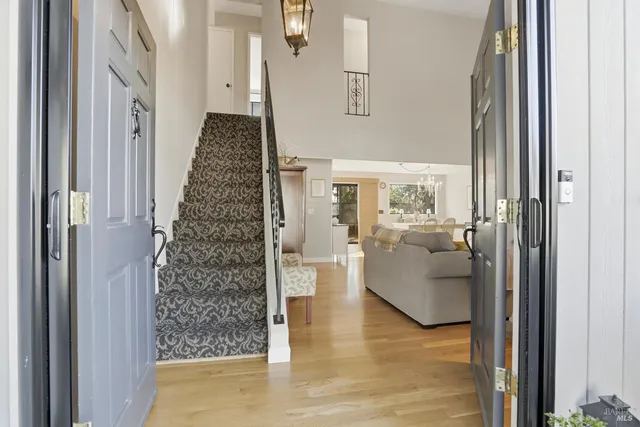 a view of an entryway with furniture and front door