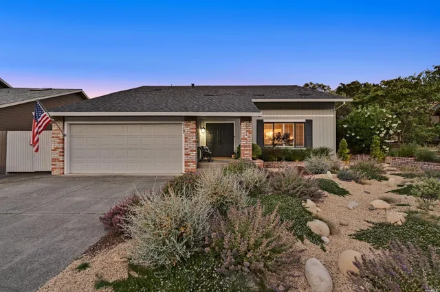 a front view of a house with garden