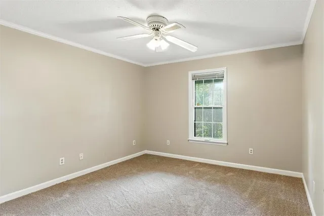 a bathroom with a granite countertop toilet a sink and a mirror
