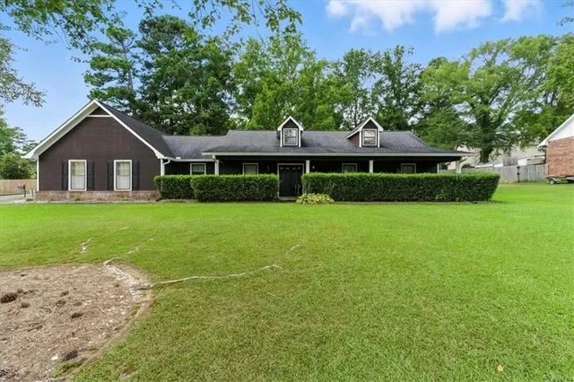 a house view with a garden space