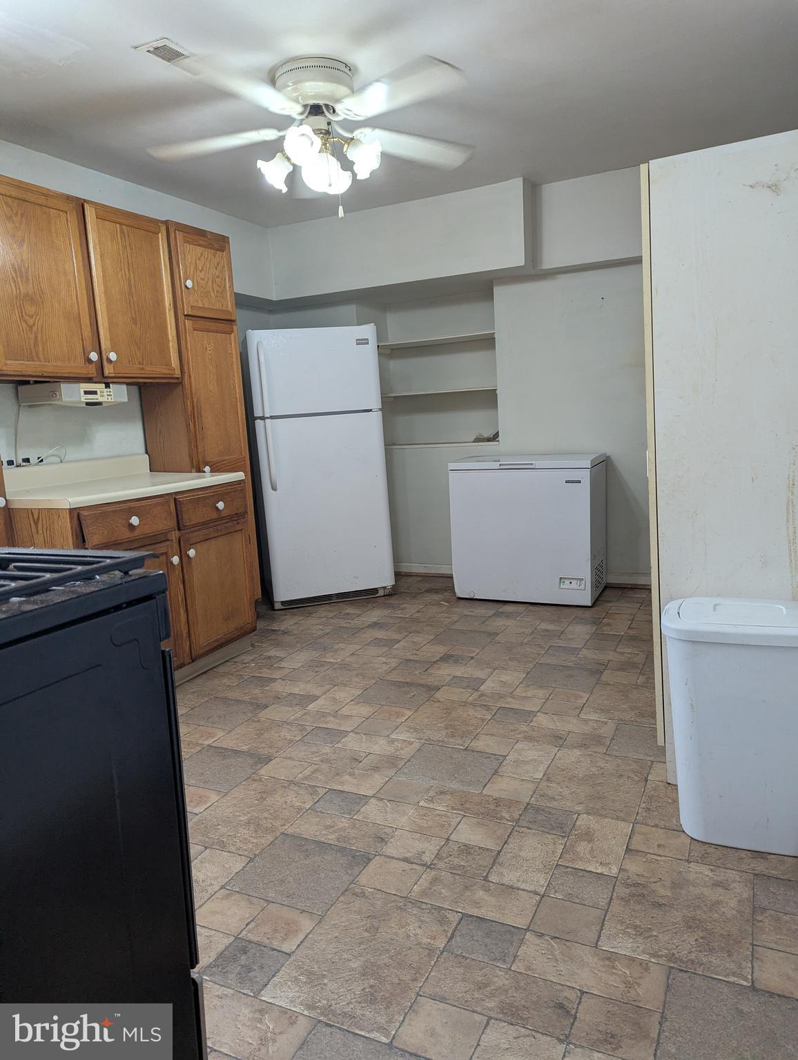 1506 Mill Race Road Baltimore, MD 21211 - Photo 11 of 13 a room with cabinets and appliances