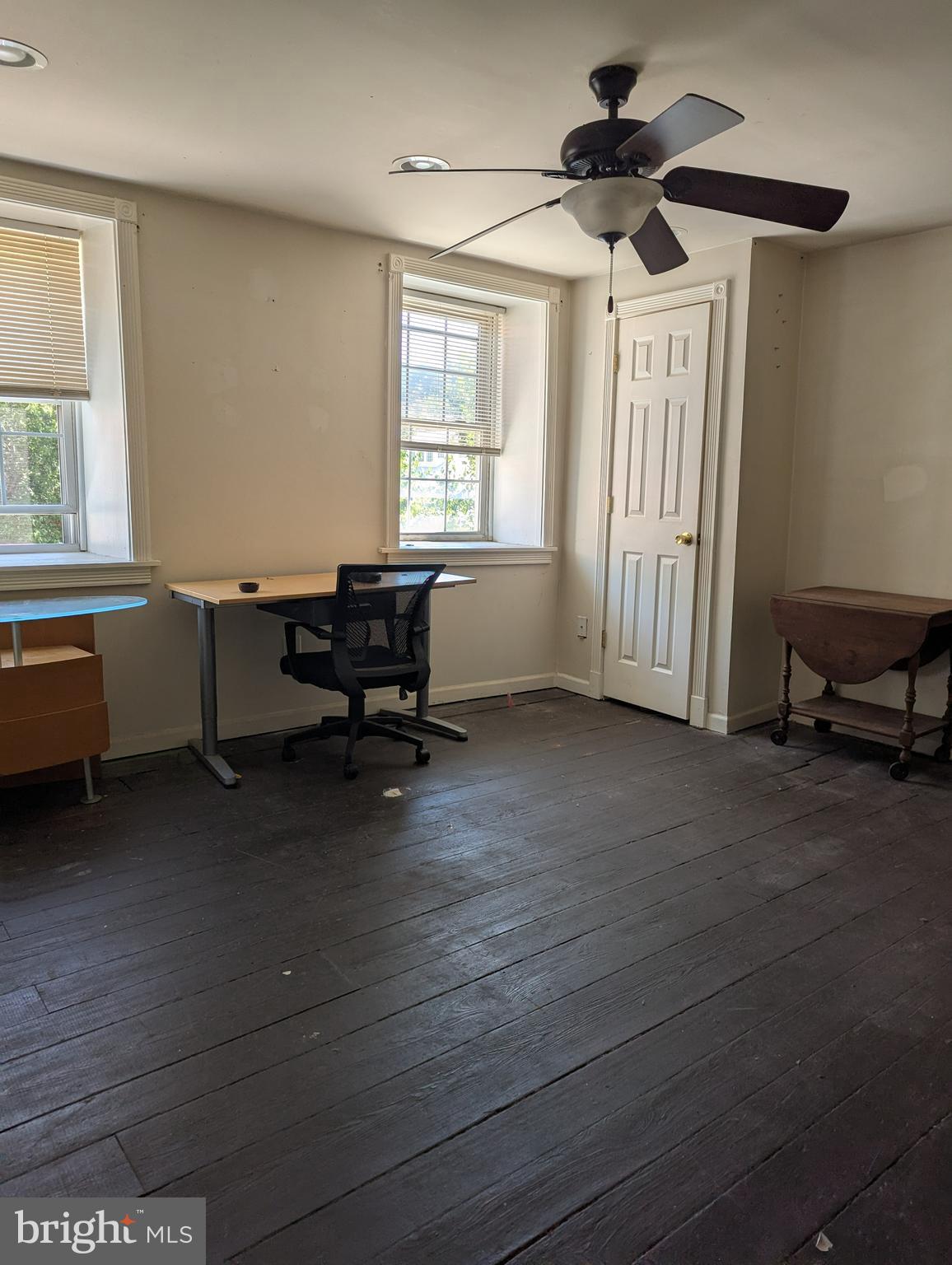 1506 Mill Race Road Baltimore, MD 21211 - Photo 12 of 13 a living room with furniture and a window