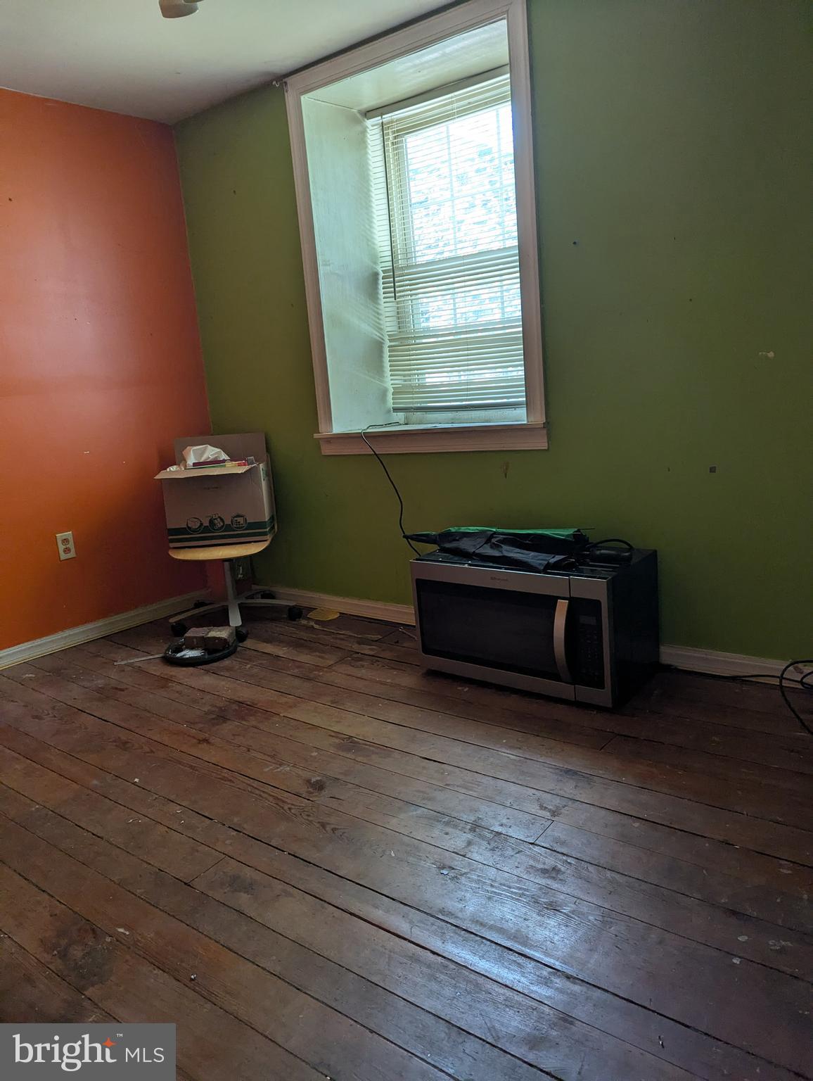 1506 Mill Race Road Baltimore, MD 21211 - Photo 13 of 13 a living room with furniture and a wooden floor