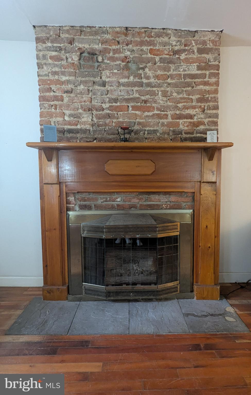 1506 Mill Race Road Baltimore, MD 21211 - Photo 3 of 13 a view of fireplace with wooden floor