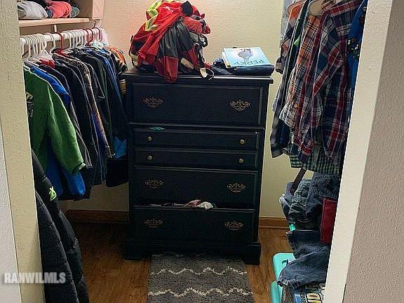 11011 West Nora Road Winslow, IL 61089 - Photo 11 of 20 a view of walk in closet with clothes and shoes
