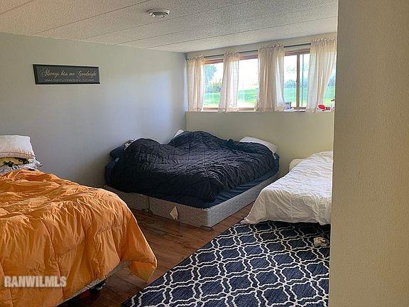 11011 West Nora Road Winslow, IL 61089 - Photo 12 of 20 a bedroom with a bed and a window