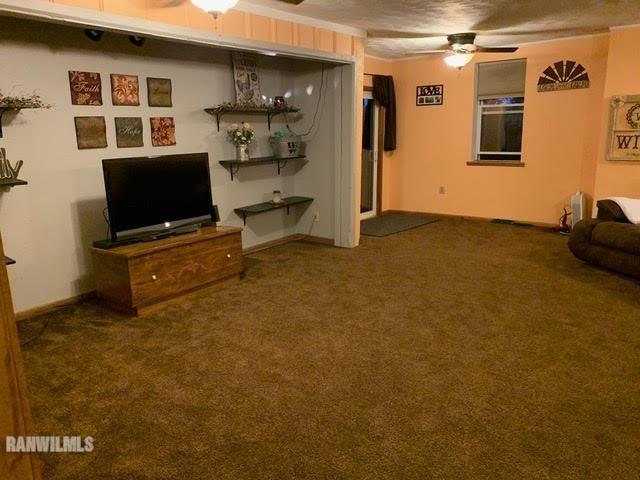 11011 West Nora Road Winslow, IL 61089 - Photo 5 of 20 a living room with furniture and a flat screen tv