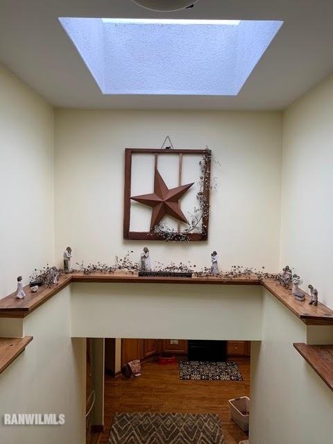 11011 West Nora Road Winslow, IL 61089 - Photo 9 of 20 a view of a room with a wooden floor and small window