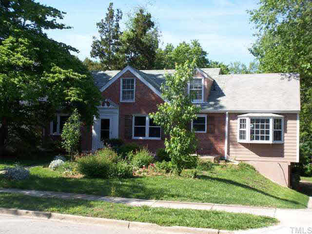 3316 Clark Avenue Raleigh, NC 27607 - Photo 1 of 10 Front view - driveway to the right, 2 fairly well-hidden patios on either side of front door. Very pretty garden spot with bench space under the dogwood tree. Exterior Front
