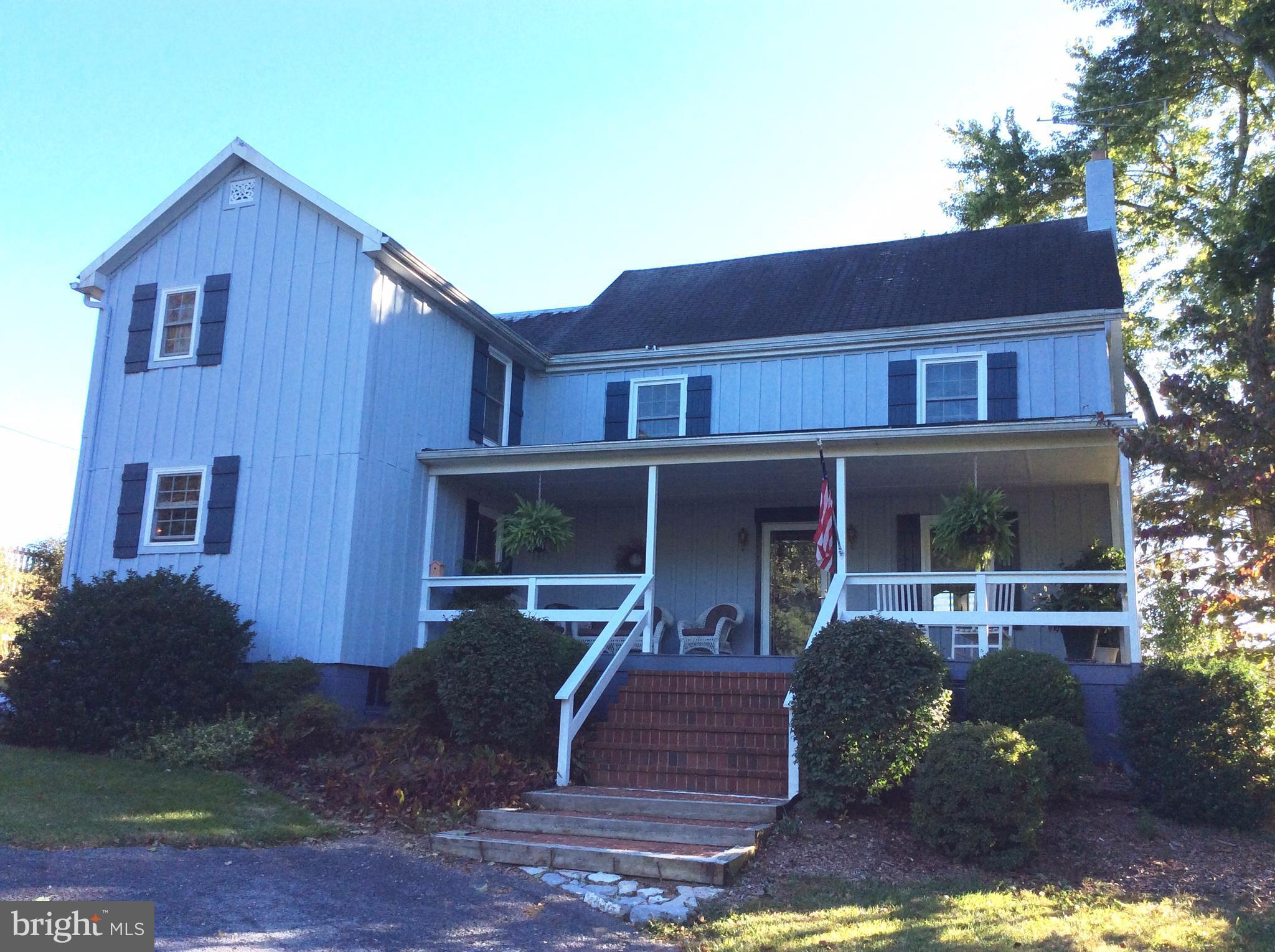 14736 Bottom Road Williamsport, MD 21795 - Photo 1 of 25 a front view of a house with garden