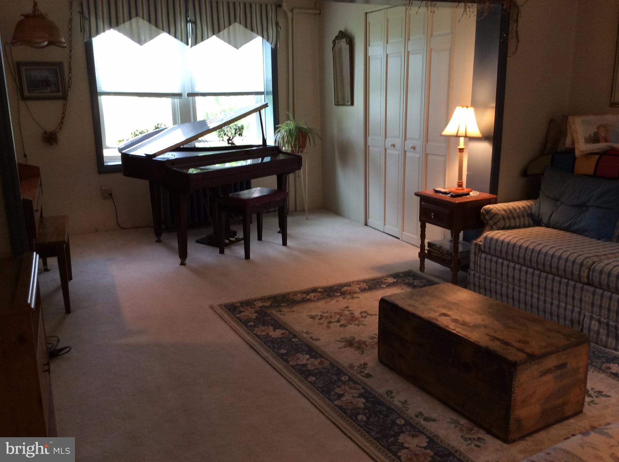 14736 Bottom Road Williamsport, MD 21795 - Photo 5 of 25 a living room with furniture a window and a table