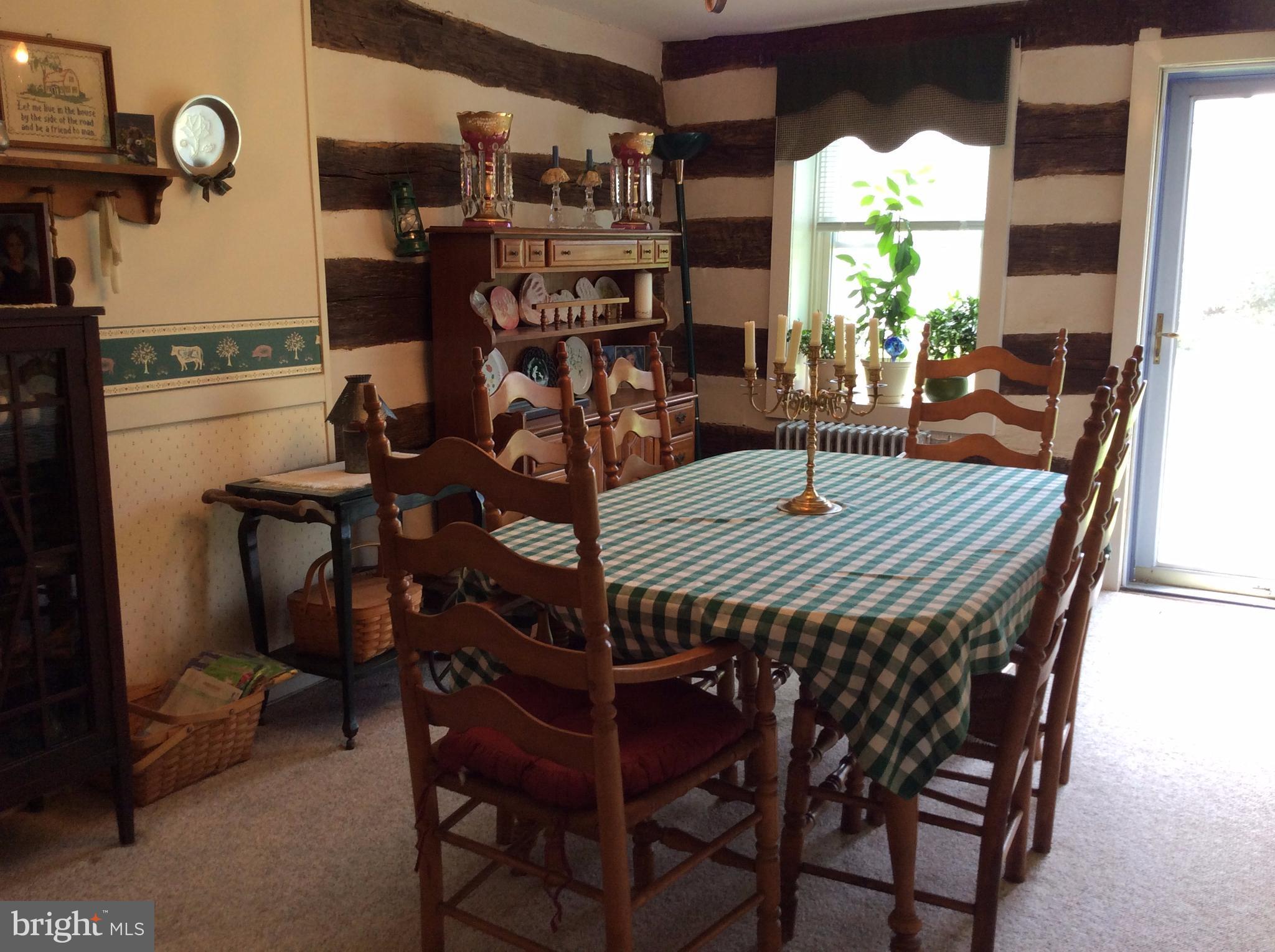 14736 Bottom Road Williamsport, MD 21795 - Photo 9 of 25 a view of a dinning table and chairs in patio