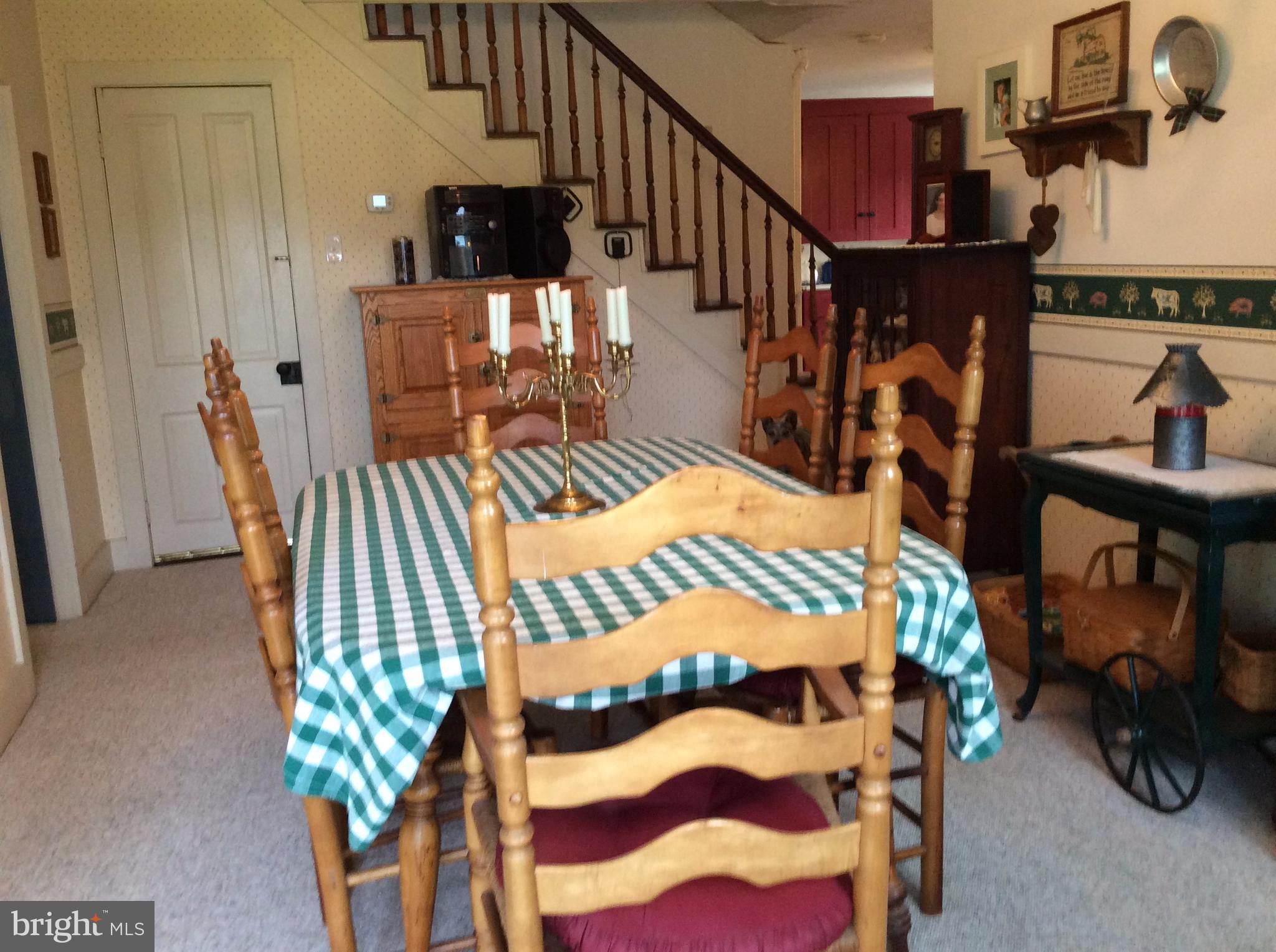 14736 Bottom Road Williamsport, MD 21795 - Photo 10 of 25 a bedroom with a bed a books bucket with a table and chairs