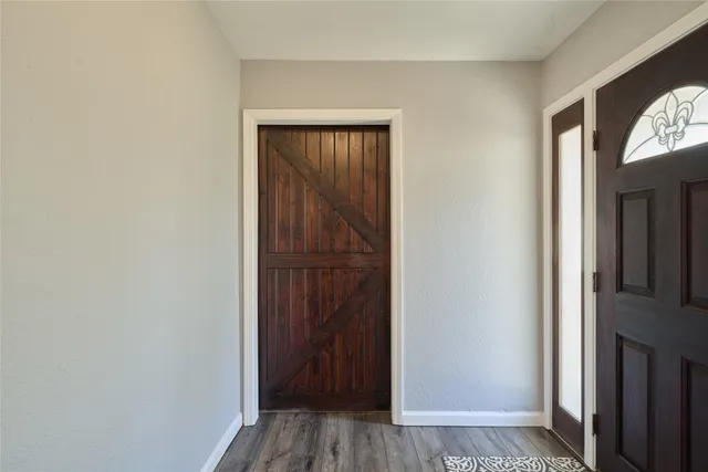 a view of front door with wooden floor