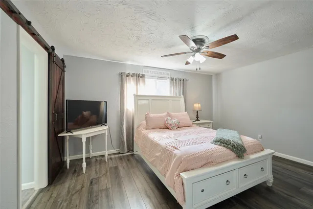 a living room with furniture and a lamp