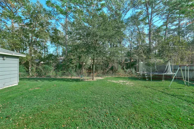a view of a backyard with a trees