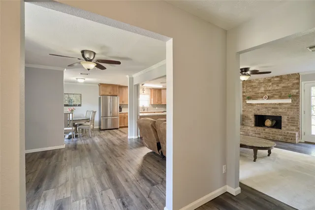 a view of a livingroom with furniture and a fireplace