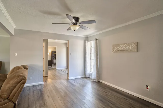 a view of a livingroom with furniture and wooden floor