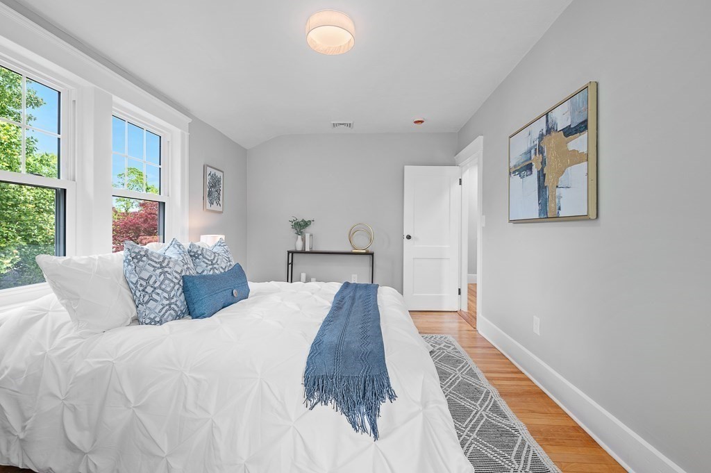 47 Brighton Road Worcester, MA 01606 - Photo 22 of 39 a spacious bedroom with a bed and a large window
