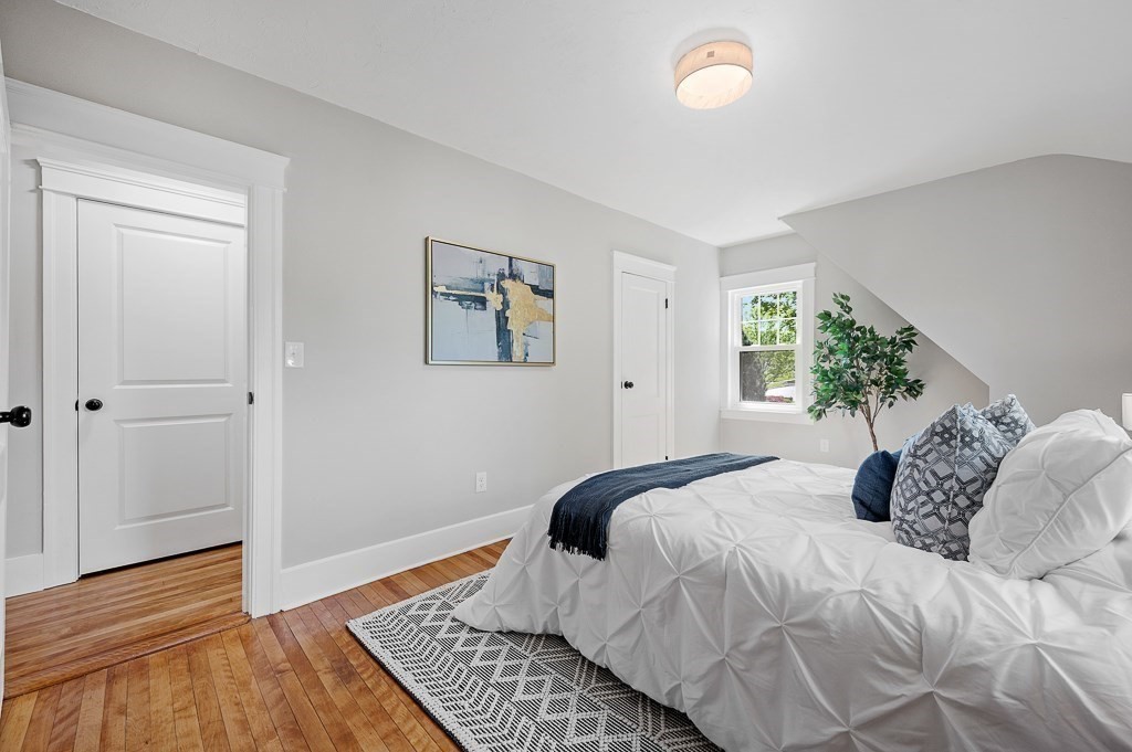 47 Brighton Road Worcester, MA 01606 - Photo 24 of 39 a bedroom with a large bed and a window