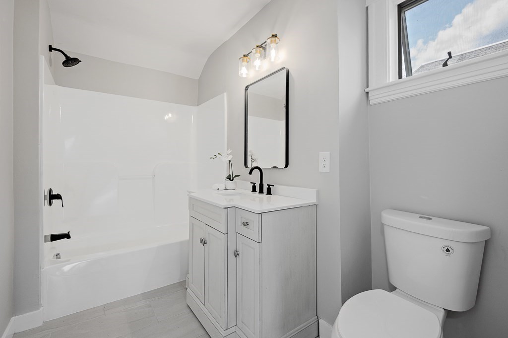 47 Brighton Road Worcester, MA 01606 - Photo 25 of 39 a bathroom with a sink a toilet and shower