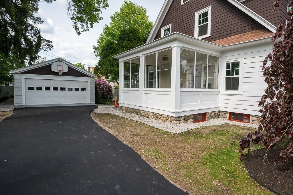 47 Brighton Road Worcester, MA 01606 - Photo 5 of 39 a front view of a house with a yard