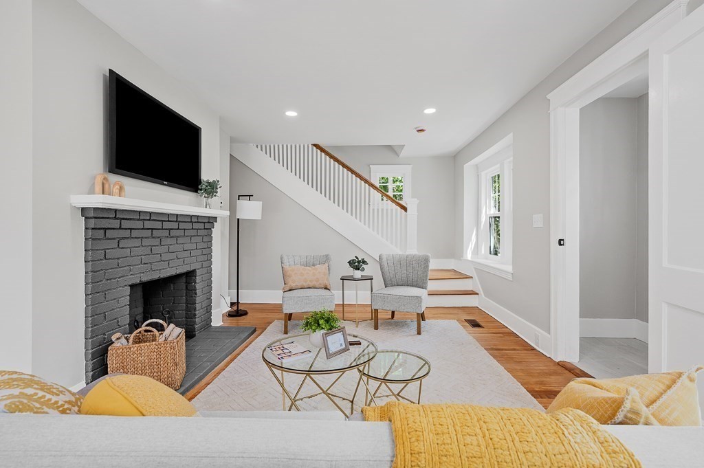 47 Brighton Road Worcester, MA 01606 - Photo 10 of 39 a living room with furniture fireplace and flat screen tv