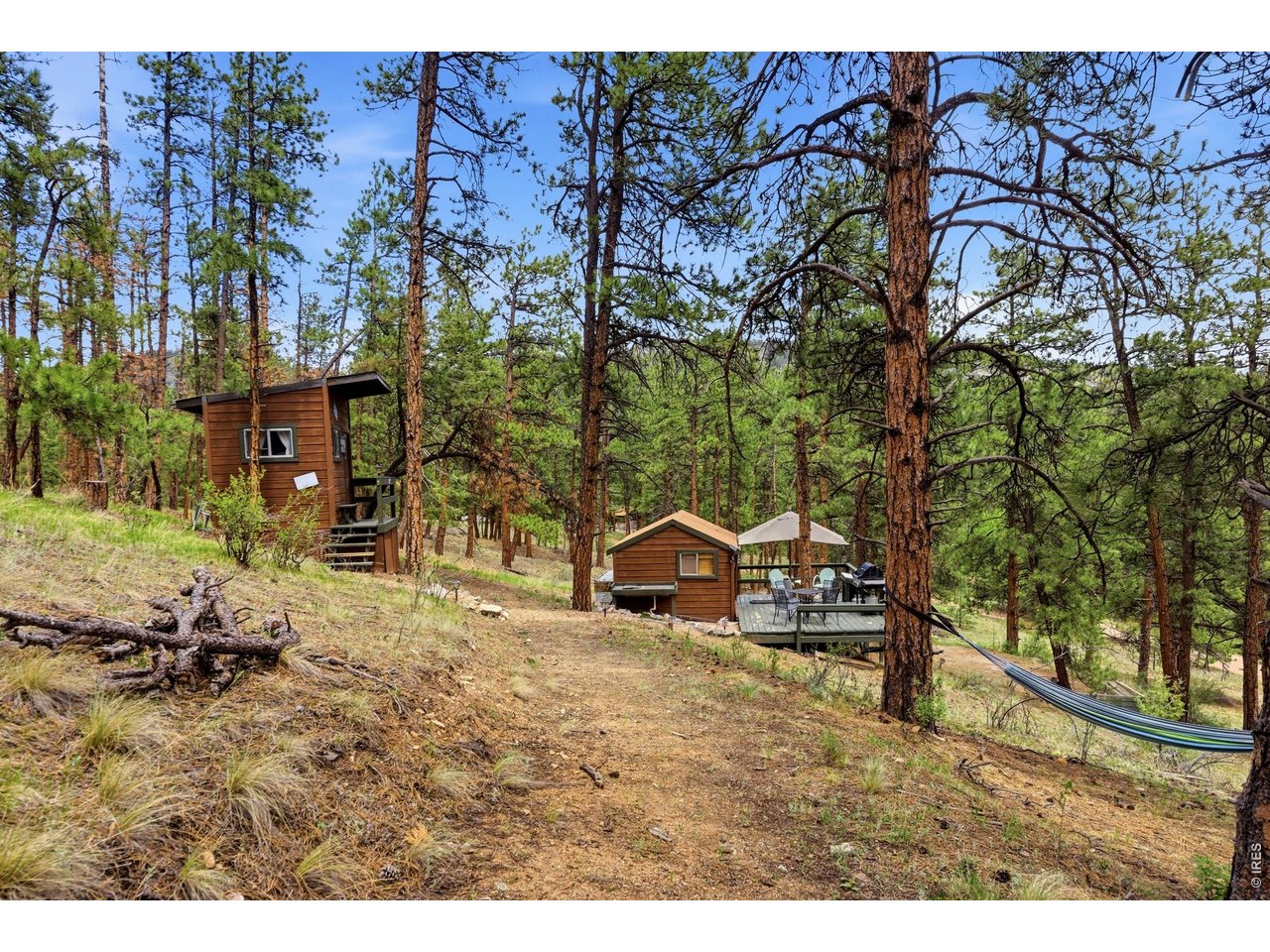 102 Insmont Drive Bailey, CO 80421 - Photo 40 of 43 Fisherman's cabin and outhouse