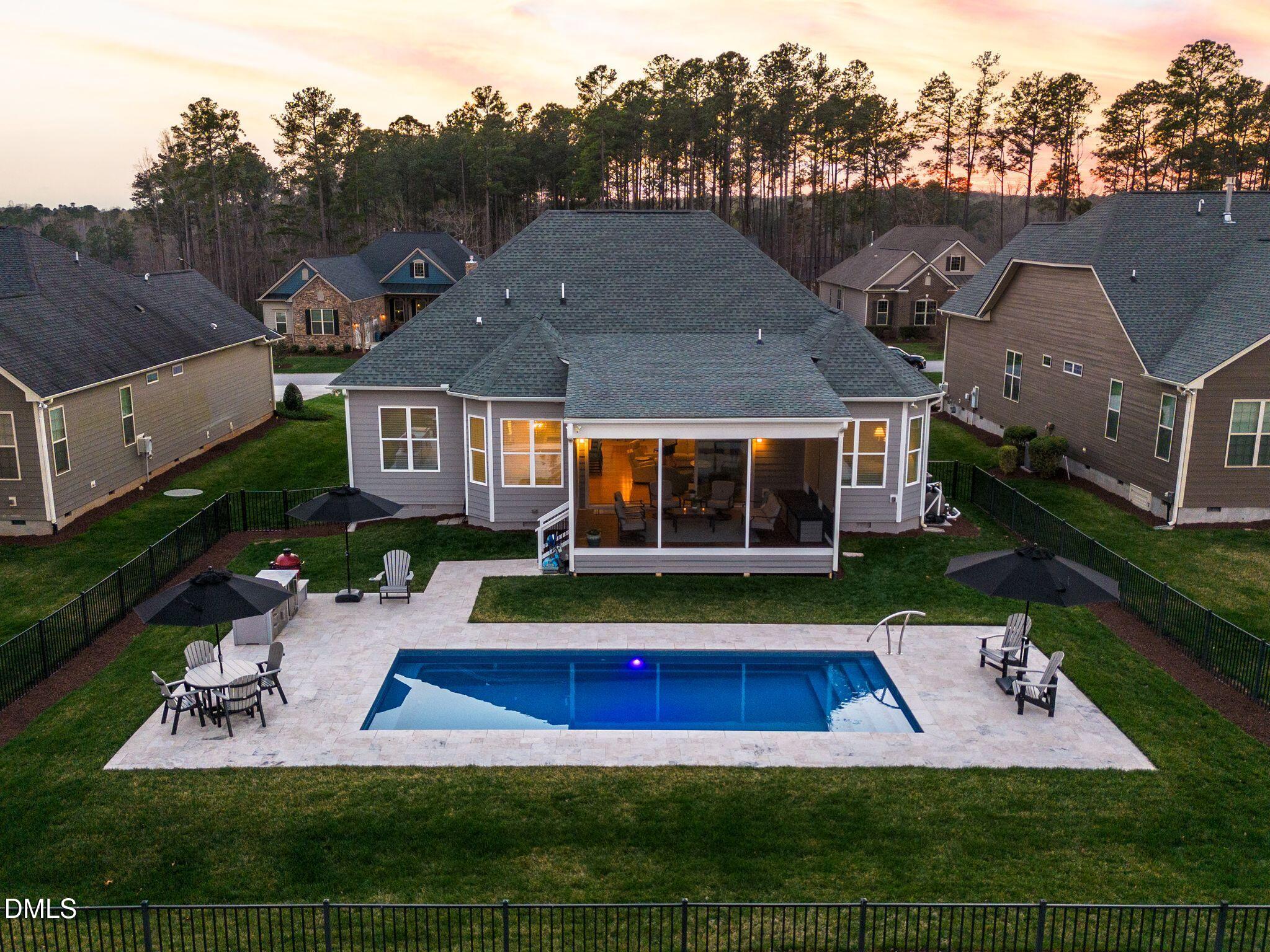 7440 Hasentree Way Wake Forest, NC 27587 - Photo 10 of 64 an aerial view of house with yard swimming pool and outdoor seating