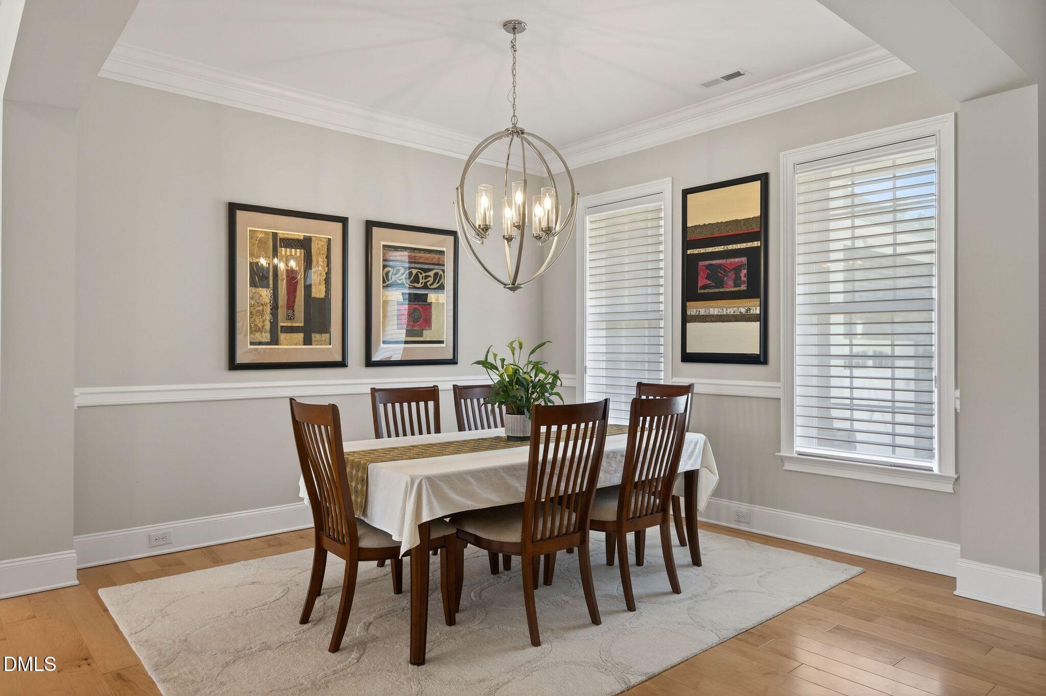 7440 Hasentree Way Wake Forest, NC 27587 - Photo 23 of 64 a view of a dining room with furniture window and wooden floor