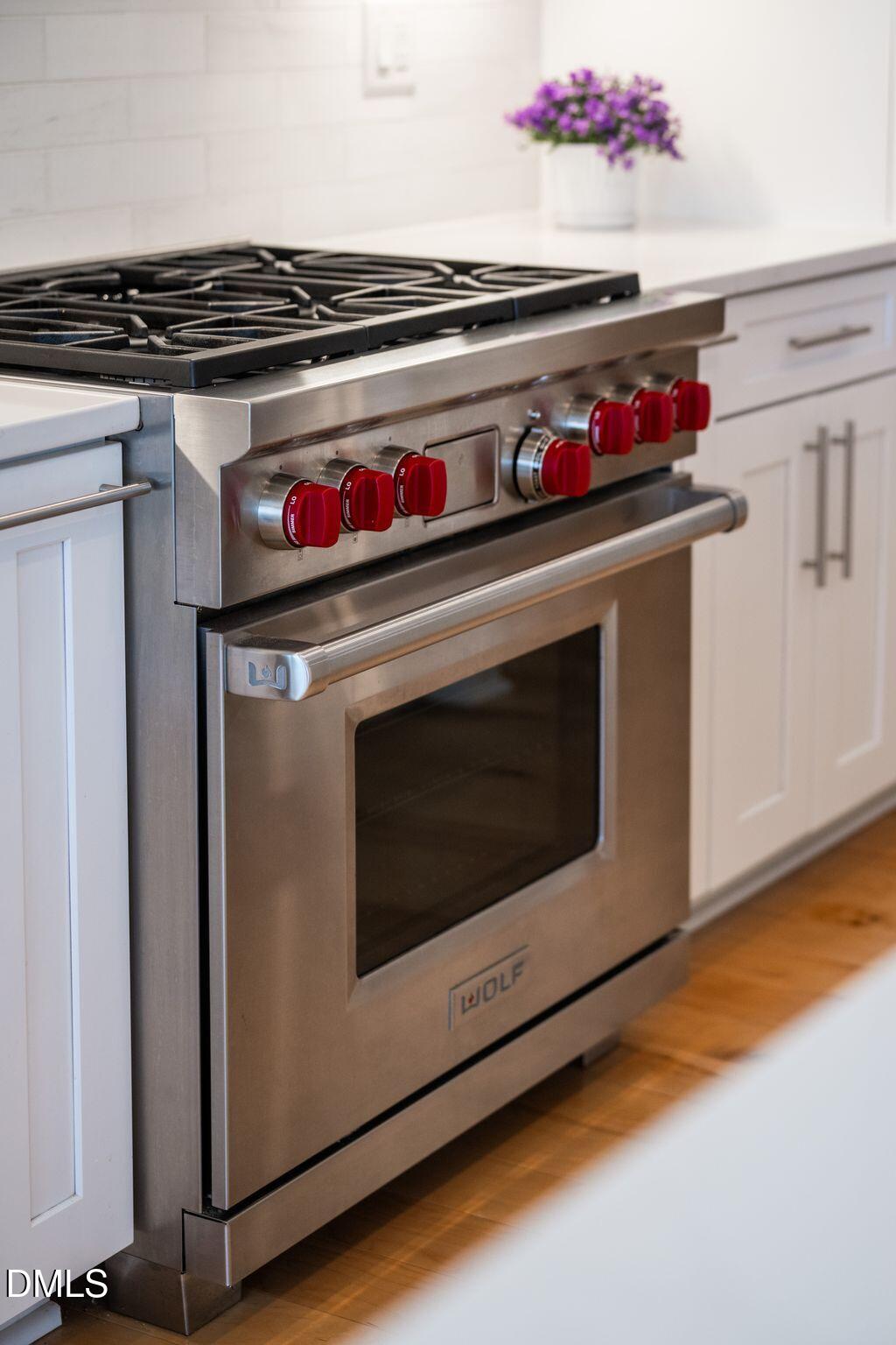 7440 Hasentree Way Wake Forest, NC 27587 - Photo 33 of 64 a stove top oven sitting inside of a kitchen