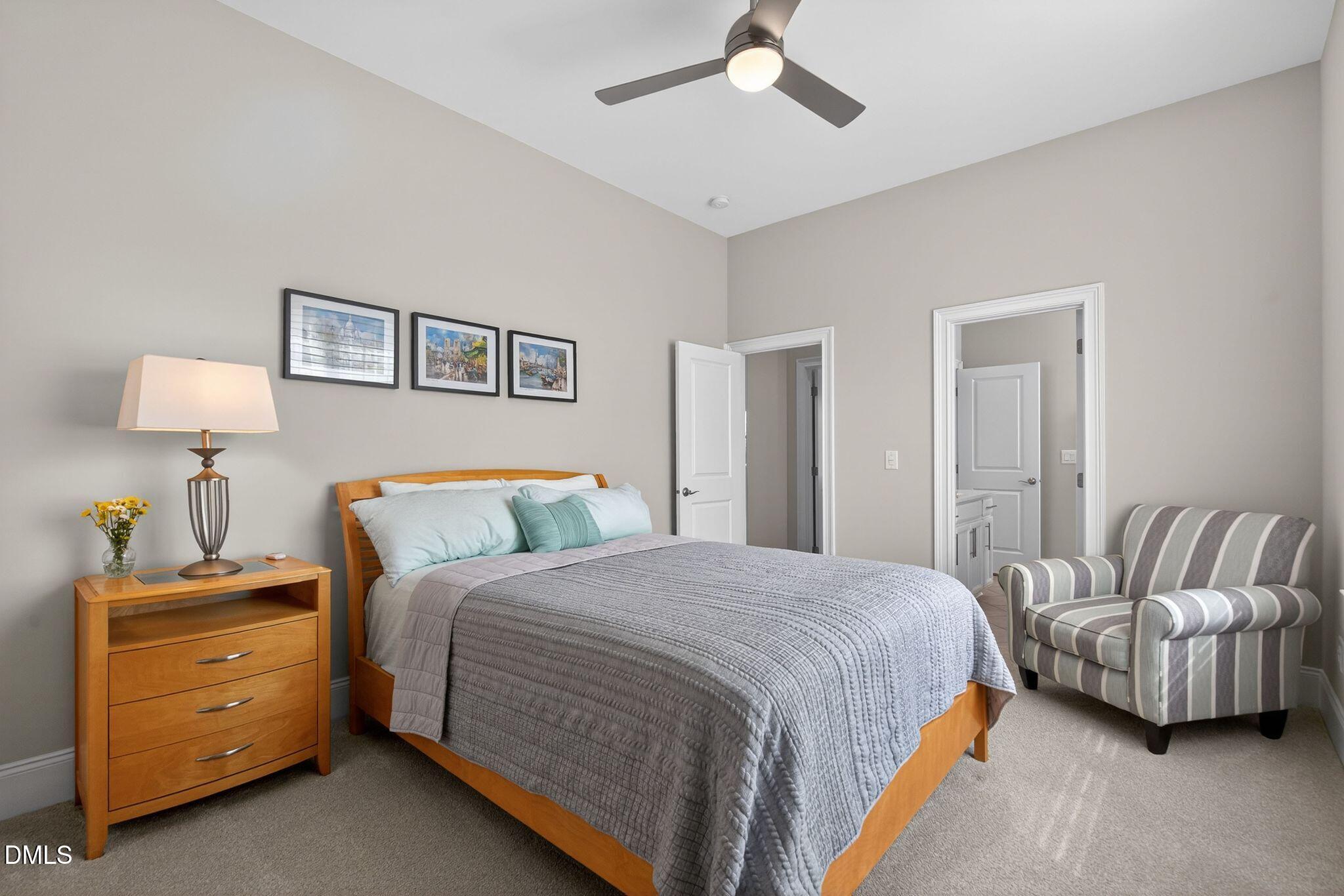 7440 Hasentree Way Wake Forest, NC 27587 - Photo 43 of 64 a bedroom with a bed and a couch