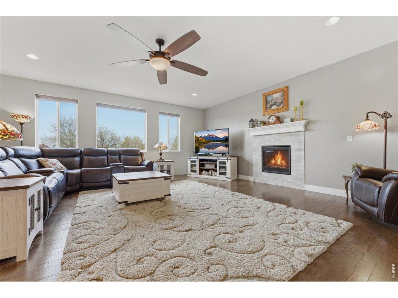 1148 Wagon Bend Road Berthoud, CO 80513 - Photo 11 of 50 a living room with furniture and a fireplace