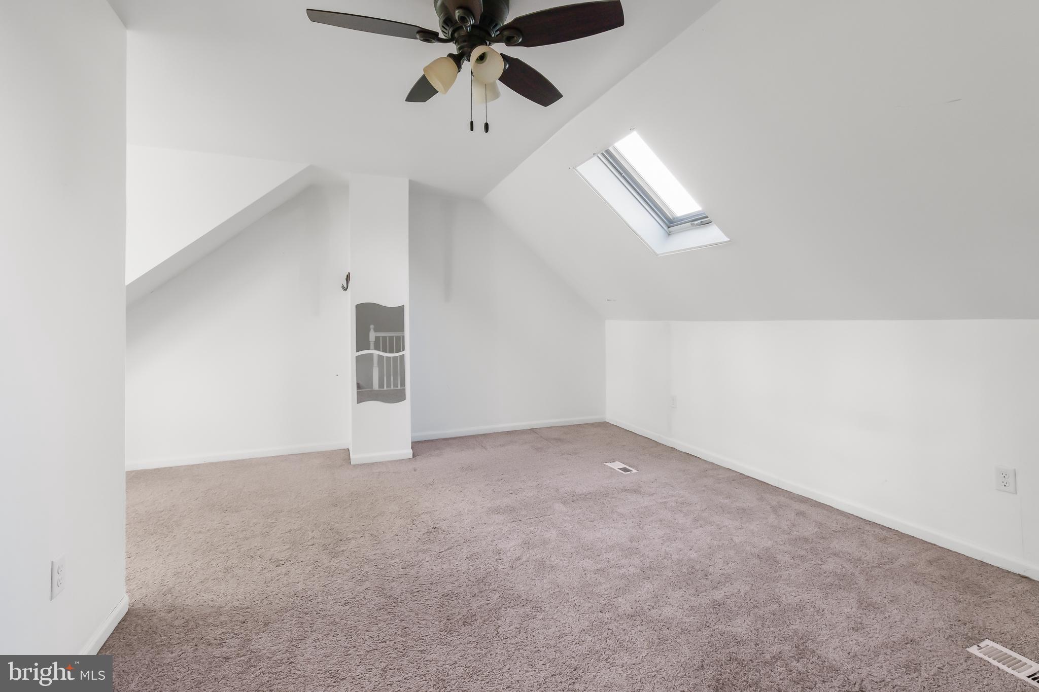 403 Cardinal Road Lititz, PA 17543 - Photo 19 of 29 an empty room with chandelier fan and windows