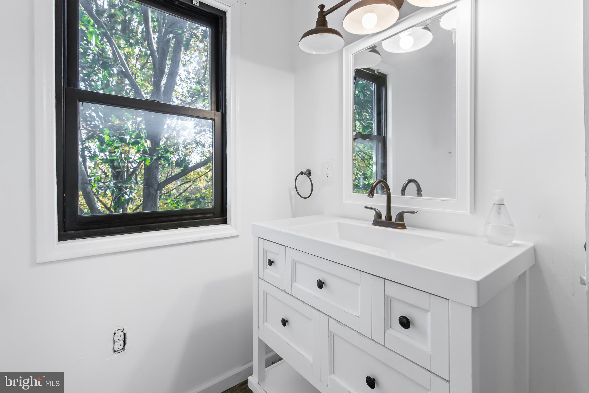 403 Cardinal Road Lititz, PA 17543 - Photo 21 of 29 a bathroom with a sink and a mirror
