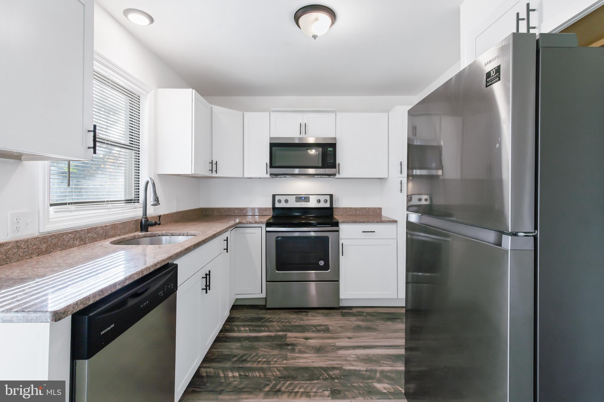 403 Cardinal Road Lititz, PA 17543 - Photo 7 of 29 a kitchen with a stove and a refrigerator