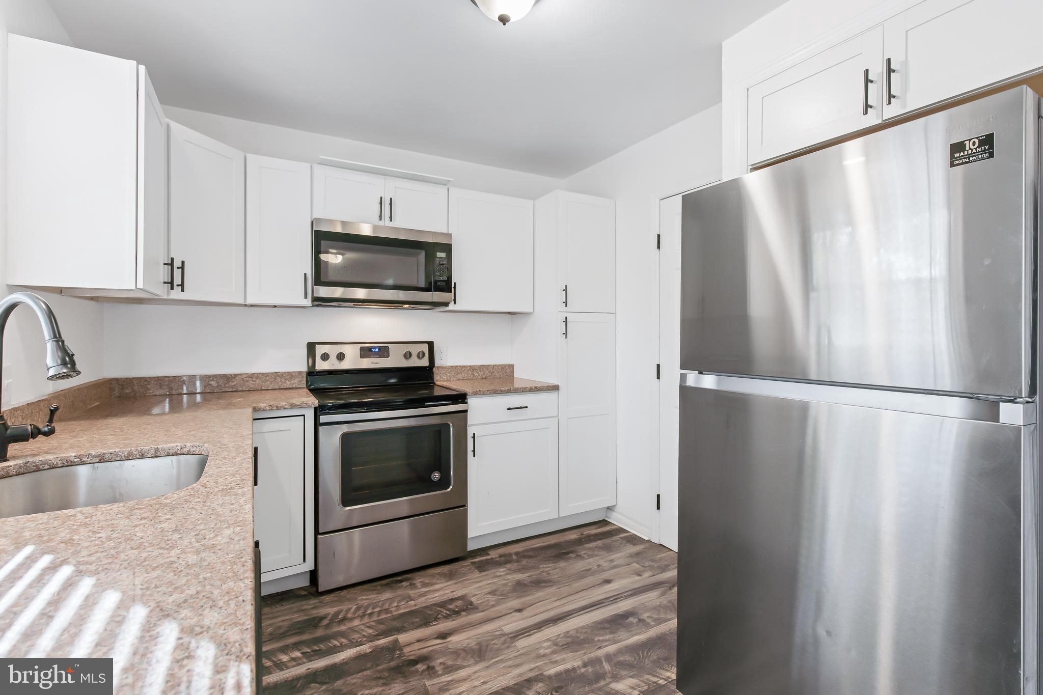 403 Cardinal Road Lititz, PA 17543 - Photo 9 of 29 a kitchen with a refrigerator sink and microwave