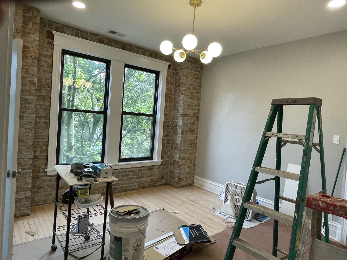 4032 North Wolcott Avenue, Unit 2R Chicago, IL 60613 - Photo 4 of 10 a view of a dining room with furniture a chandelier and wooden floor