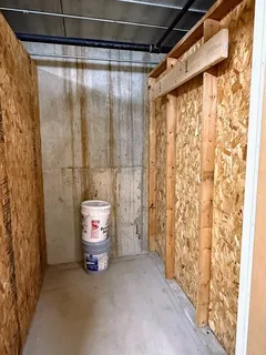 a bathroom with a shower curtain and a toilet