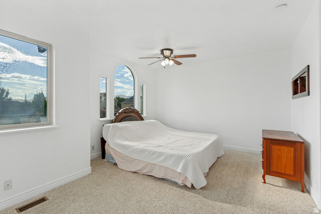 1585 South 910 West Payson, UT 84651 - Photo 14 of 32 Room featuring a ceiling fan with light fixture, light-toned carpet flooring, and white baseboard trim