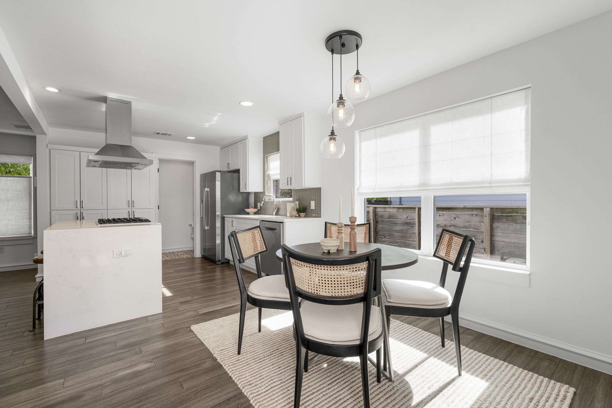 605 Harris Avenue Austin, TX 78705 - Photo 16 of 34 The kitchen and dining areas flow into each other effortlessly, bright and connected in all the right ways.