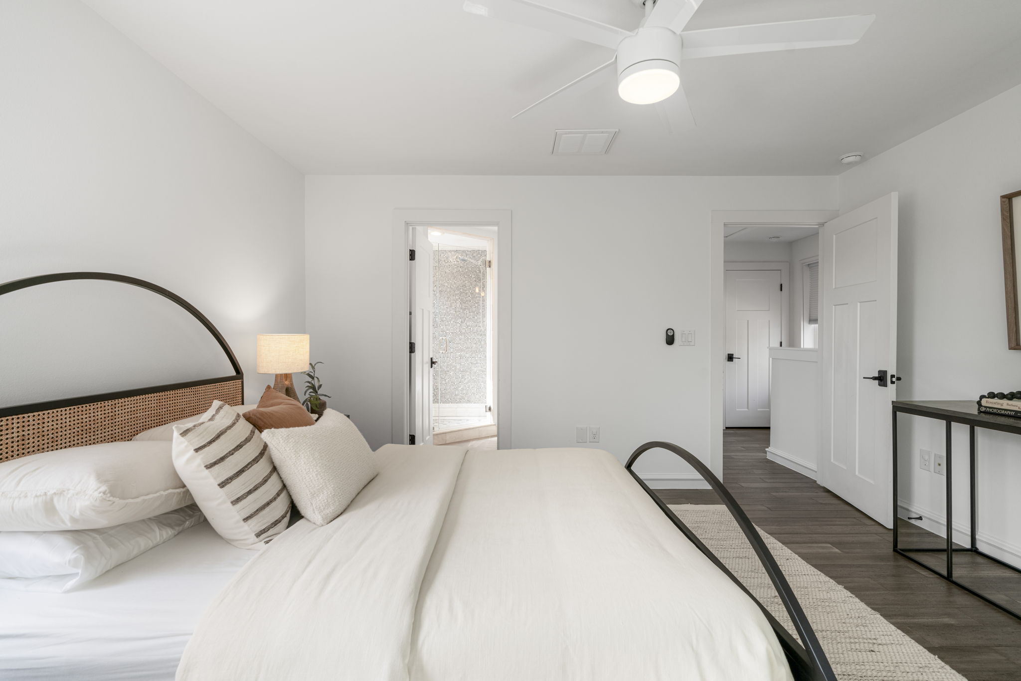 605 Harris Avenue Austin, TX 78705 - Photo 18 of 34 The primary suite, flowing naturally into its own private bath, is a quiet, connected retreat at the end of a long day.