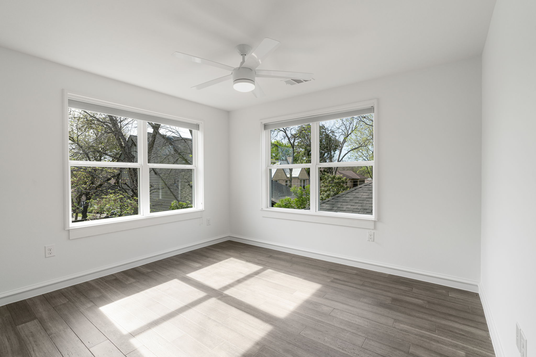 605 Harris Avenue Austin, TX 78705 - Photo 21 of 34 Corner windows, treetop views, and beautiful natural light make the second bedroom a genuinely lovely room.