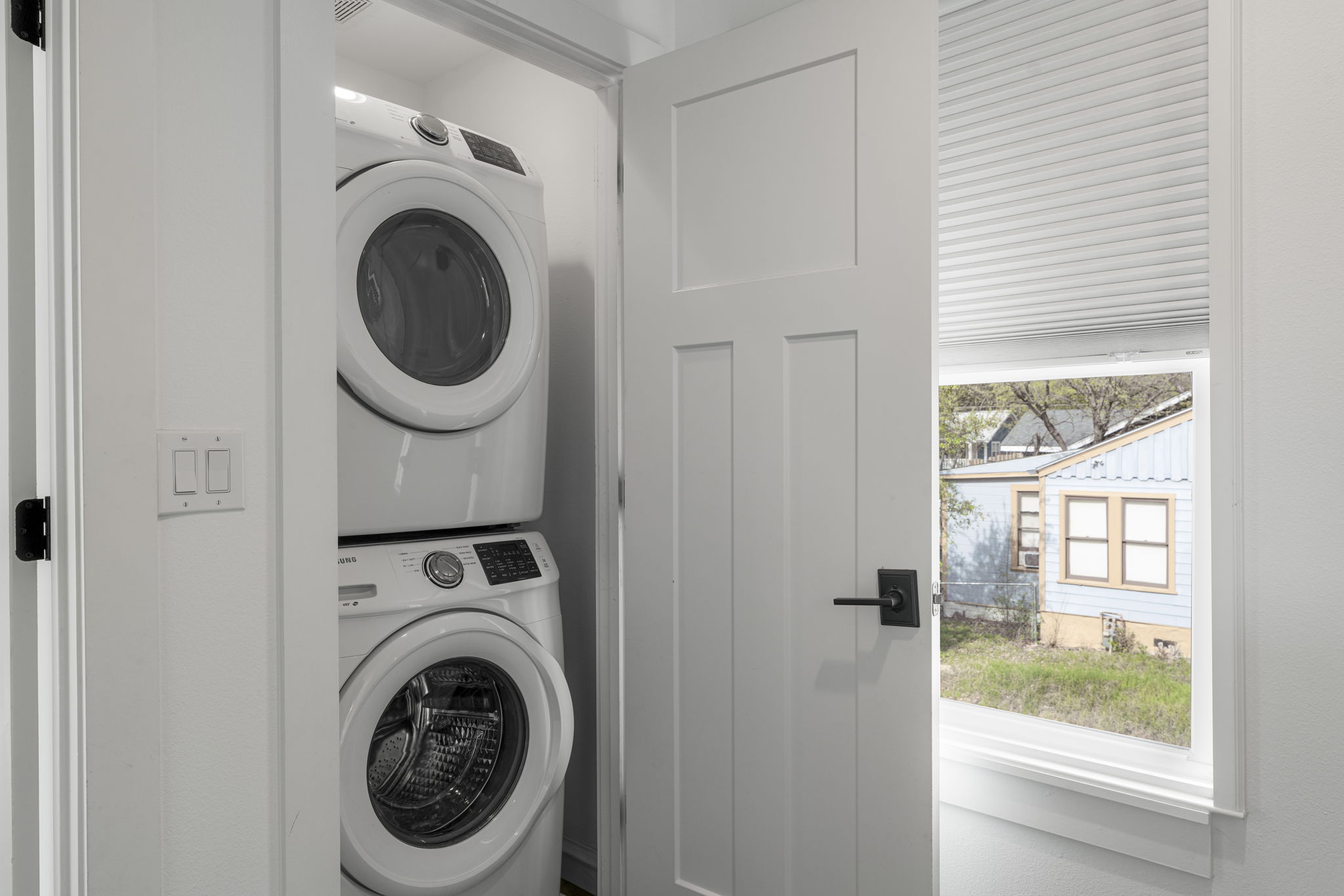 605 Harris Avenue Austin, TX 78705 - Photo 24 of 34 The included stackable washer and dryer are tucked neatly away.