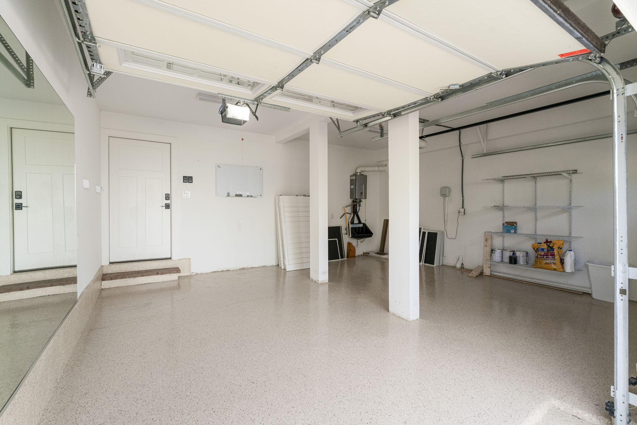 605 Harris Avenue Austin, TX 78705 - Photo 25 of 34 The epoxy floor gives the oversized two-car garage a clean, polished feel that makes it just as easy to picture as a home gym or workshop as a place to park.