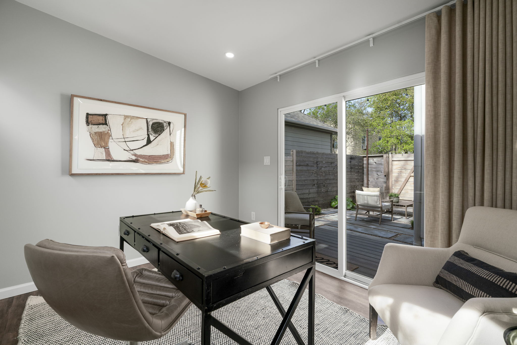 605 Harris Avenue Austin, TX 78705 - Photo 28 of 34 The sliding glass door opens to the back deck and fills the office pod with natural light and greenery. This is a creative space that feels anything but closed off.